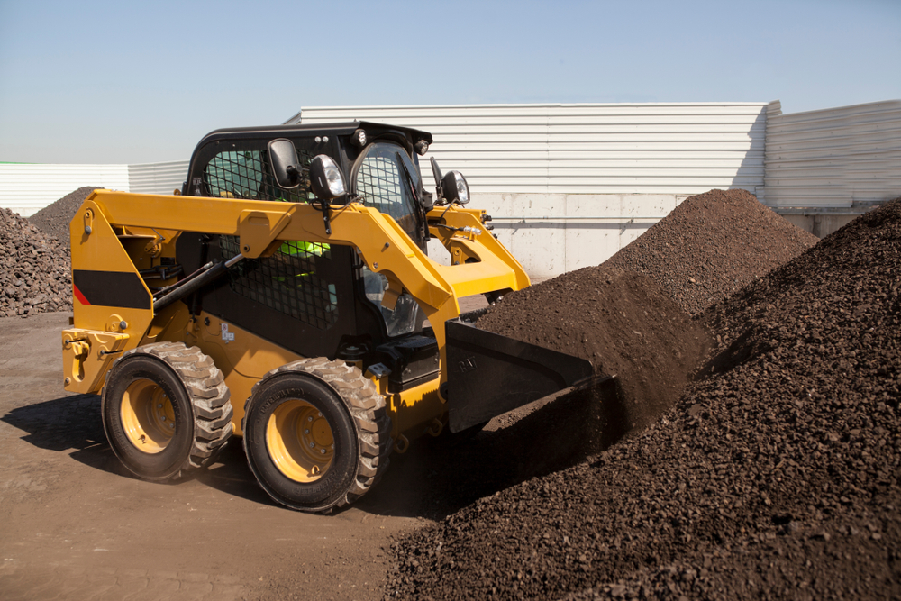 skid steer moving soil