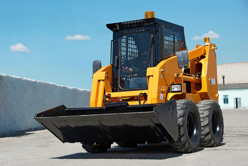 skid steer going to construction site